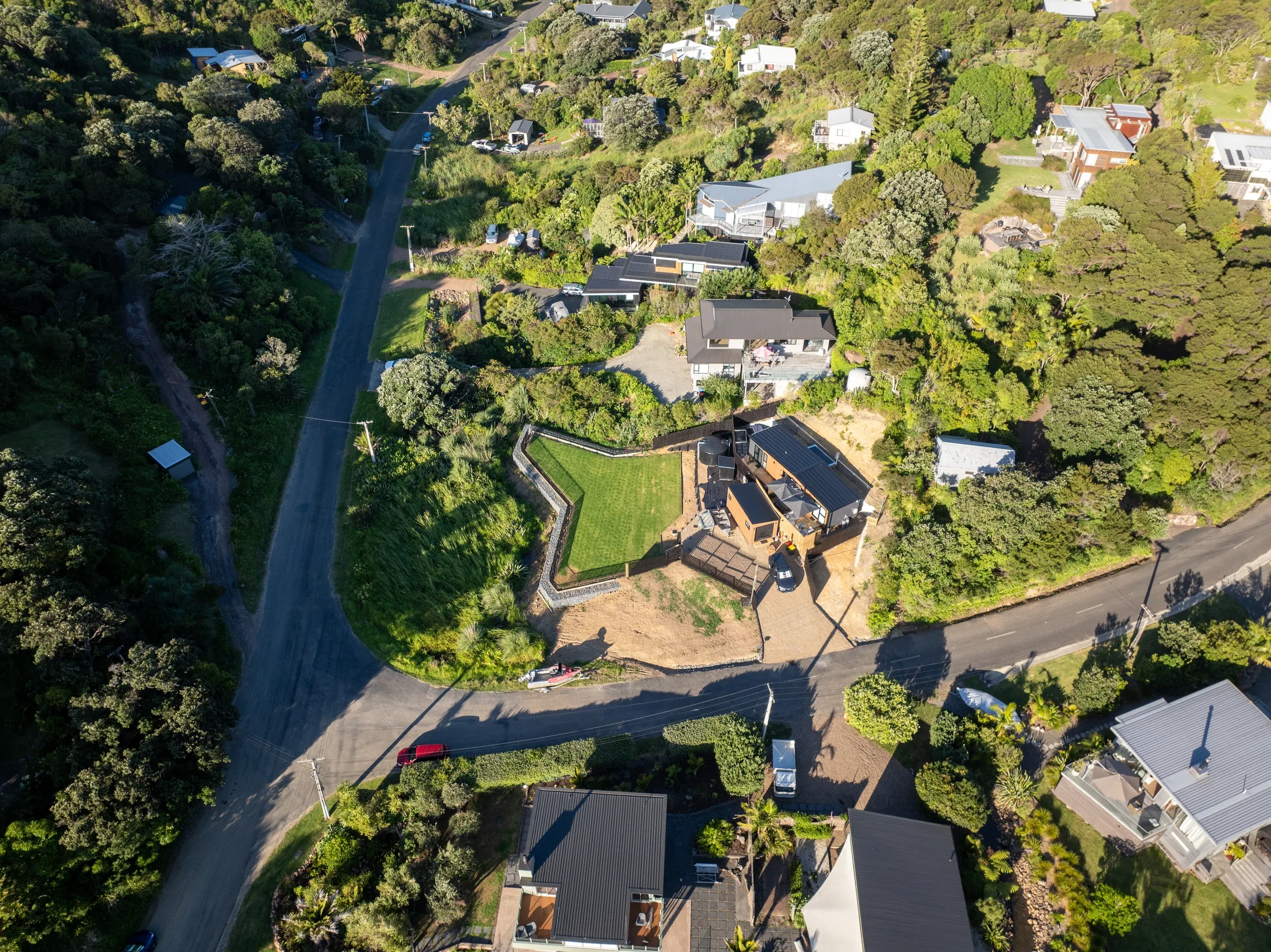 Aerial view from above the street showing the completed driveway, terrace and retaining as one.