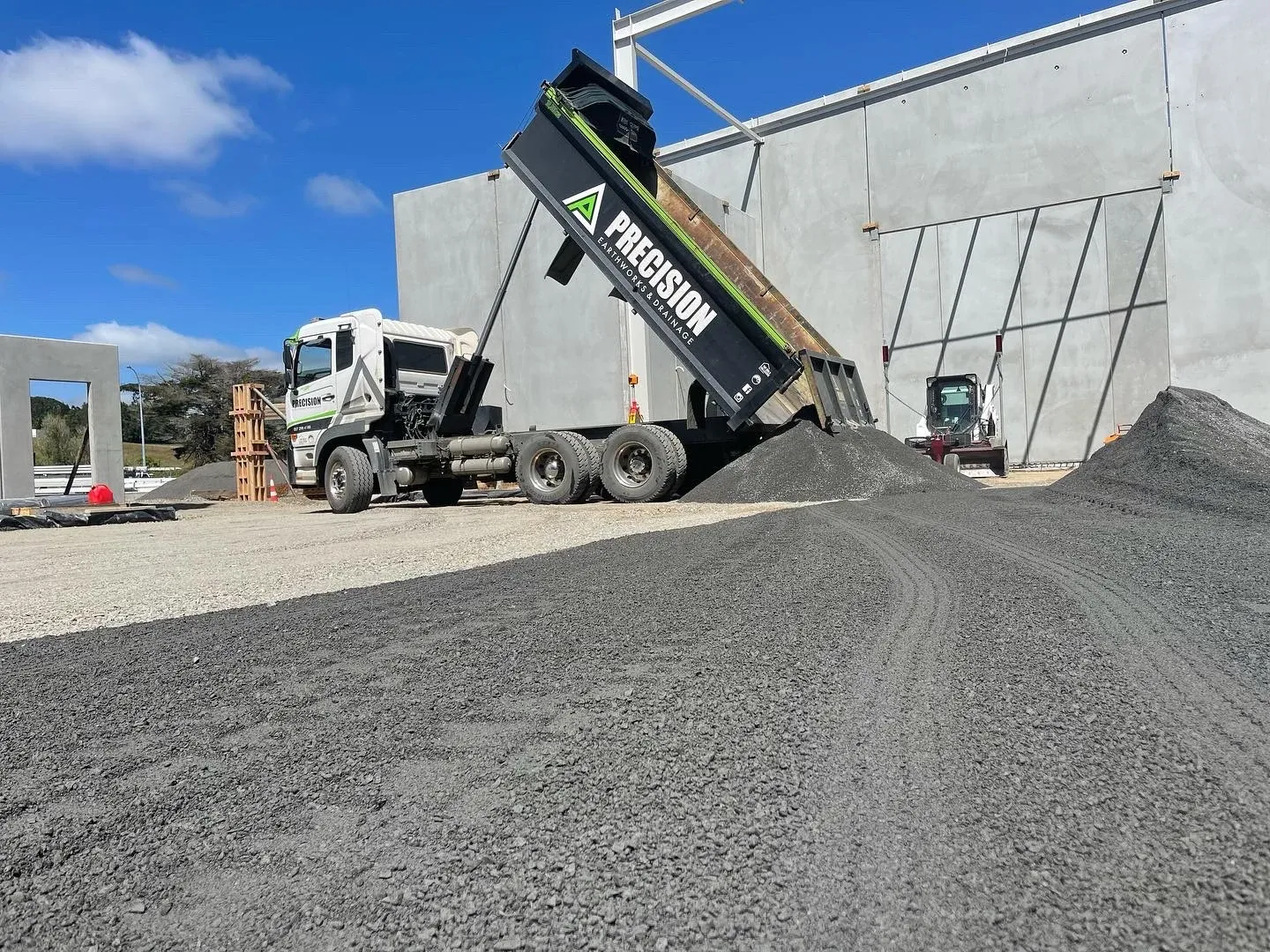 Drainage and services trench open across a civil construction site