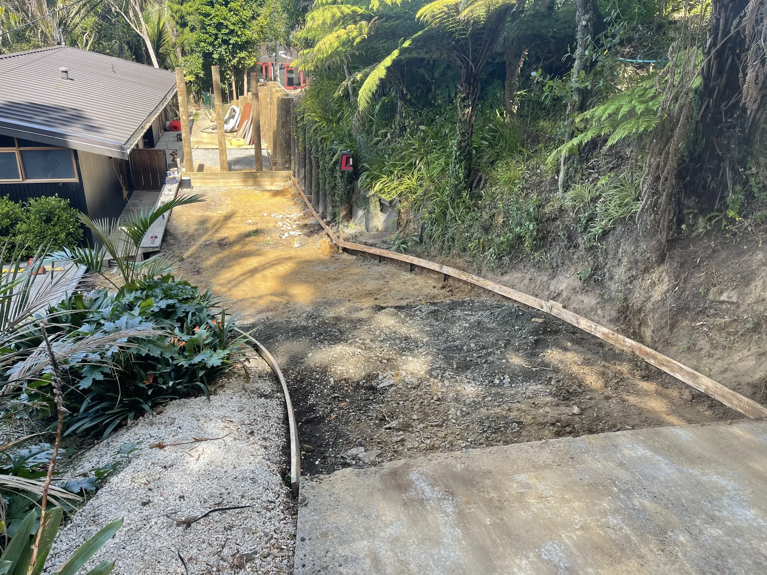 Driveway formation cut and shaped across a sloping residential section