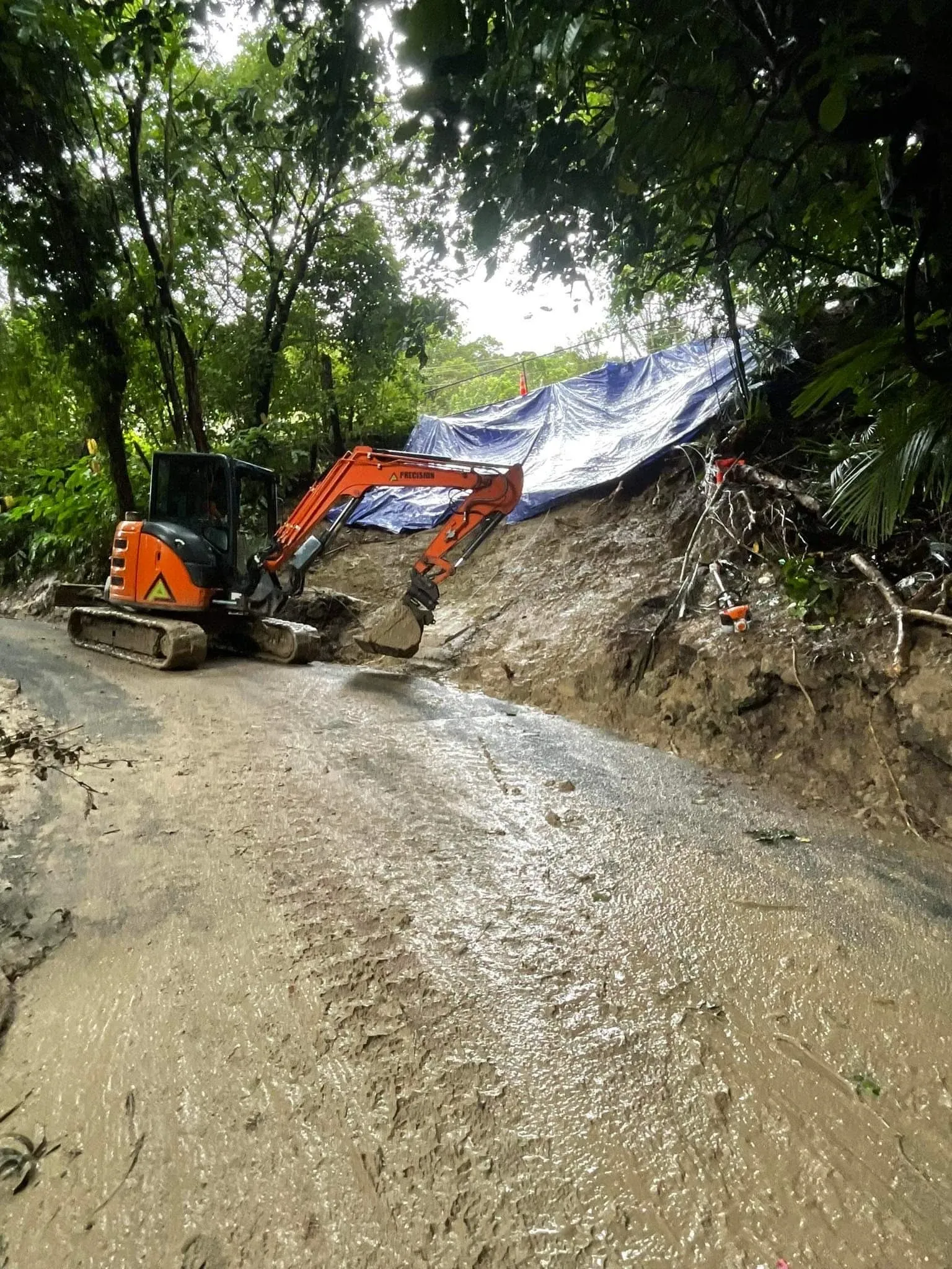 Failed slope under repair with an engineered soldier pile retaining system